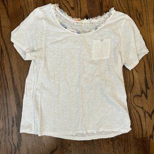 white anthropologie t shirt with frayed colorful fabric neckline